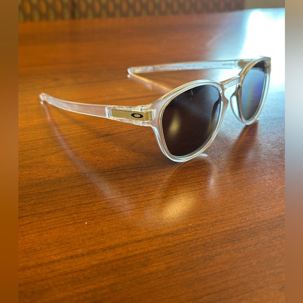 Oakley Transparent Frame Sunglasses with Dark Lenses